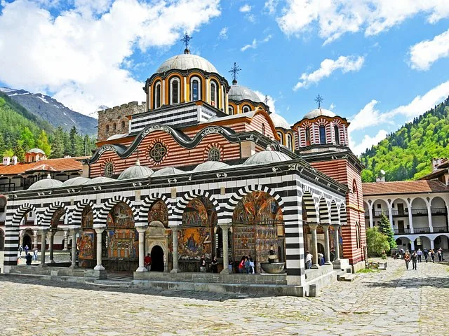 The striking striped exterior and domes of the main church at Rila Monastery