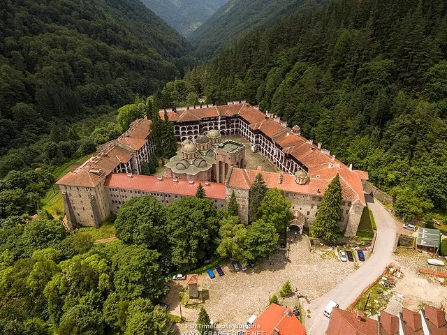 Aerial view of the entire Rila Monastery complex nestled in a mountain valley